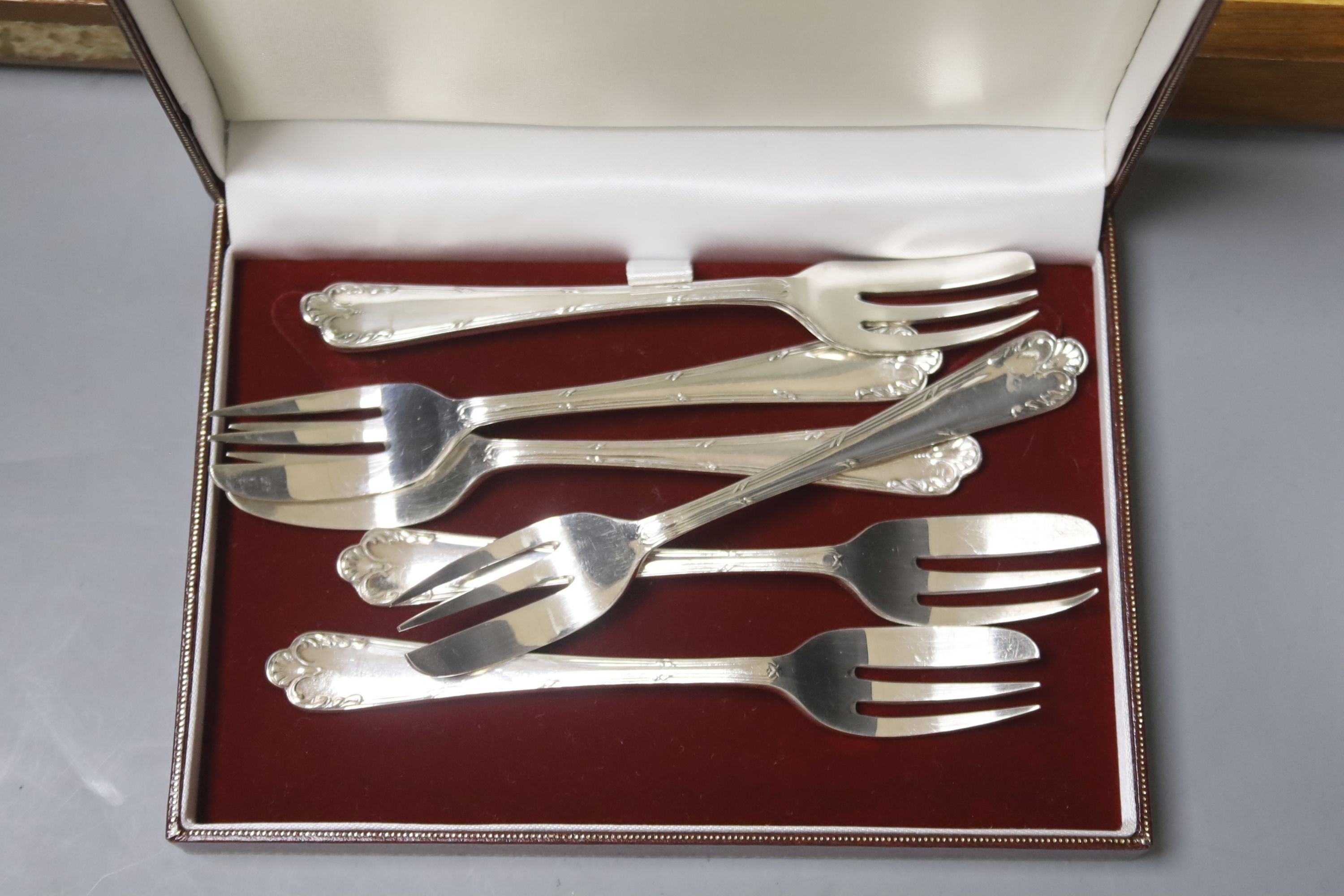 Four cased plated sets